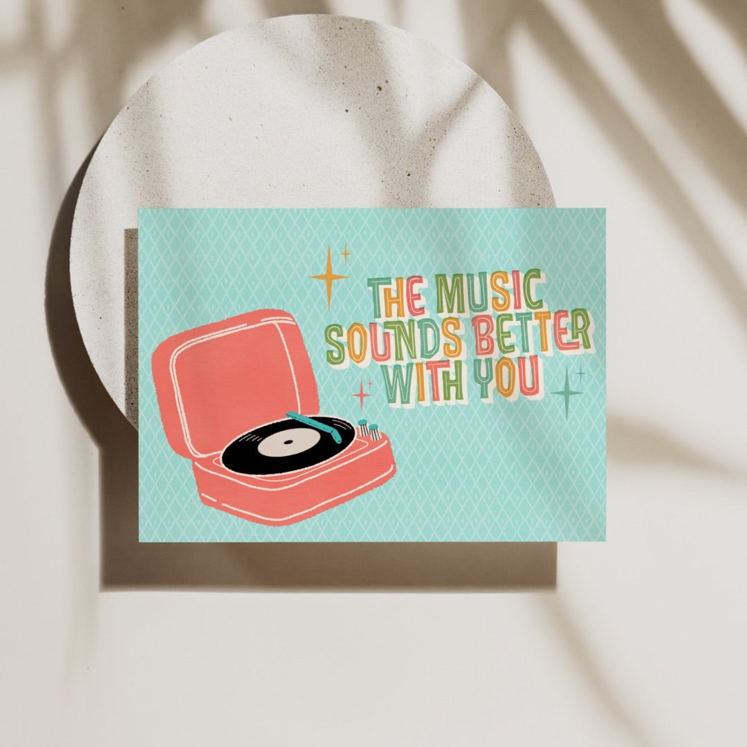 Peggy Press Co[product_name]The music sounds better with you! If sharing songs with your bae is your love language, then this is the card for you! This retro vinyl music Valentine's Day card is the perfect way to show your loved one how much you care. The card features a vintage record player design, complete with a spinning vinyl record, paired with playful retro typography. Inside, the card is blank, providing ample space to write your own heartfelt message. The card is made of high-quality pa